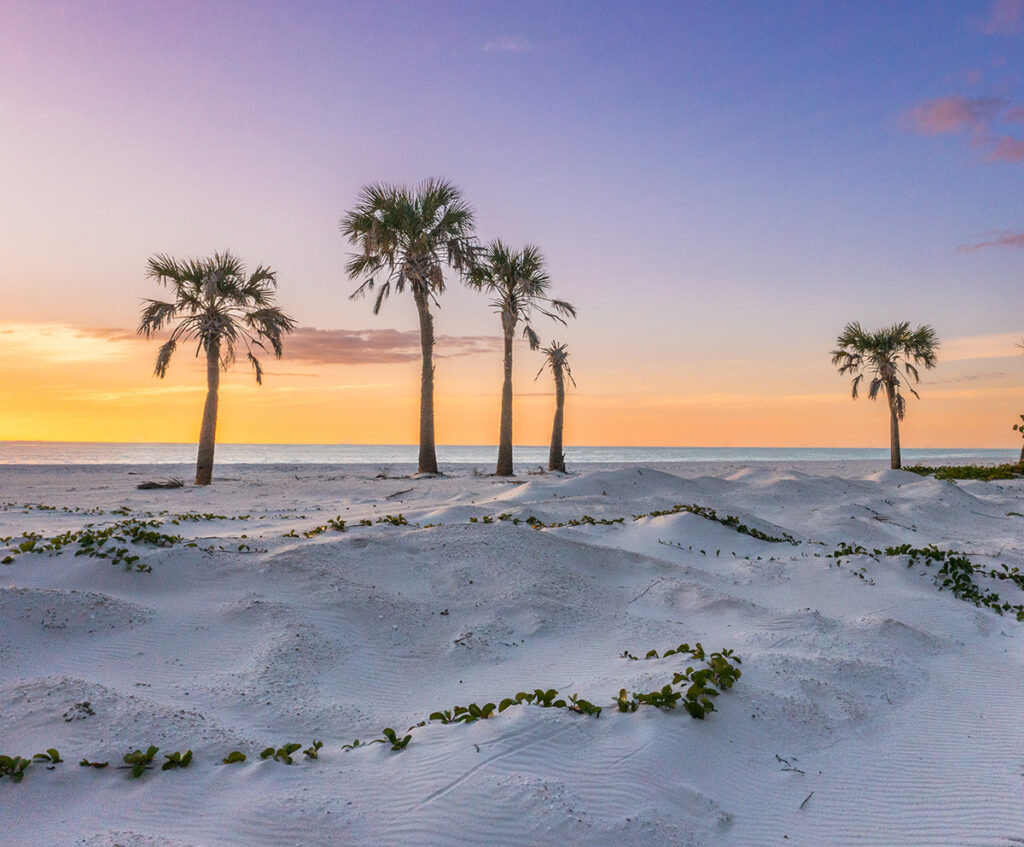 The beach at sunset at Delnor-Wiggins Pass State Park in North Naples, Florida.