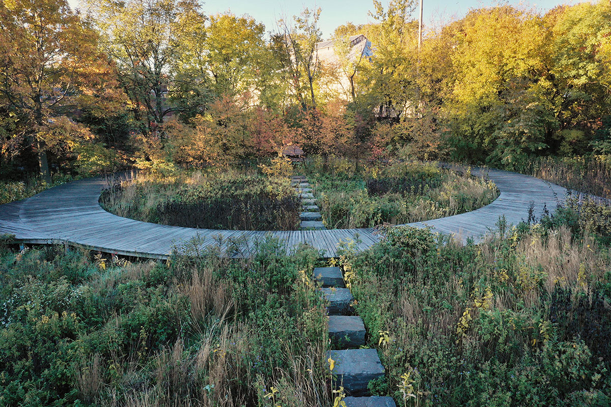 The Naval Cemetery Landscape meadow with a path made from mooring blocks.