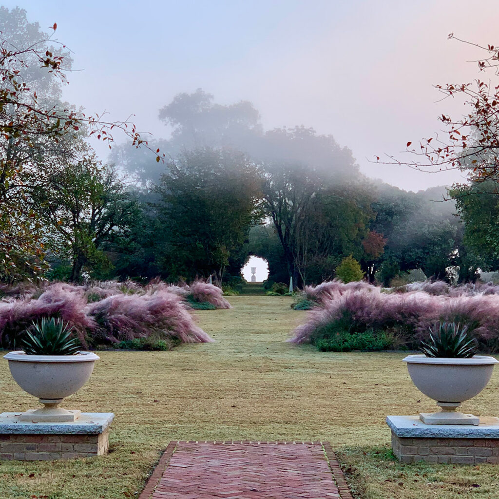 Jean-Marc Flack of Hortulus Animae uses swathes of pink muhly grass (Muhlenbergia capillaris) in a formal herbaceous parterre at this historic property in Virginia.