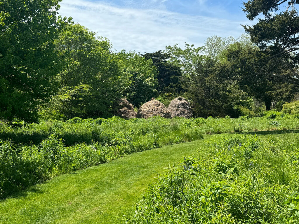 Nature-based garden with habitat stacks in the meadow